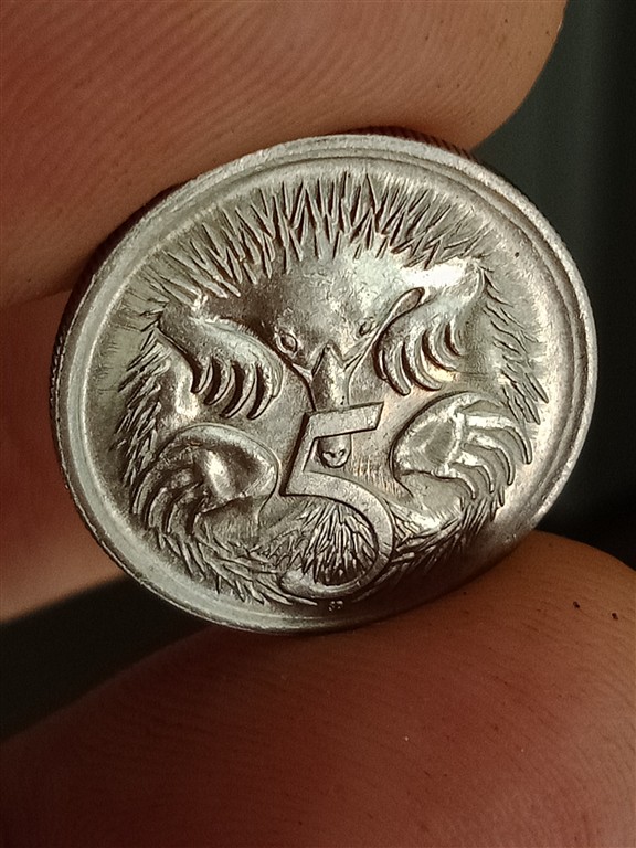 Strange-Radiating-Lines-On-1988-5-Cents